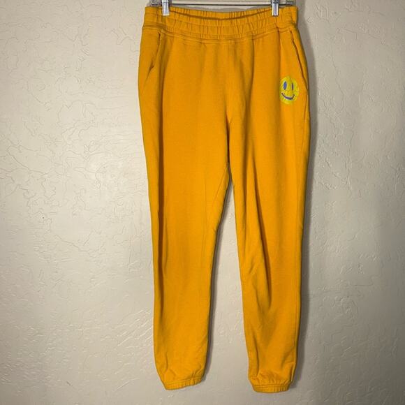 Outdoor voices smiley face sweatpant joggers in mustard yellow. - Picture 1 of 7